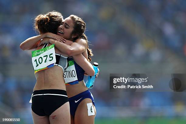 Abbey D'Agostino of the United States hugs Nikki Hamblin of New Zealand after the Women's 5000m Round 1 - Heat 2 on Day 11 of the Rio 2016 Olympic...