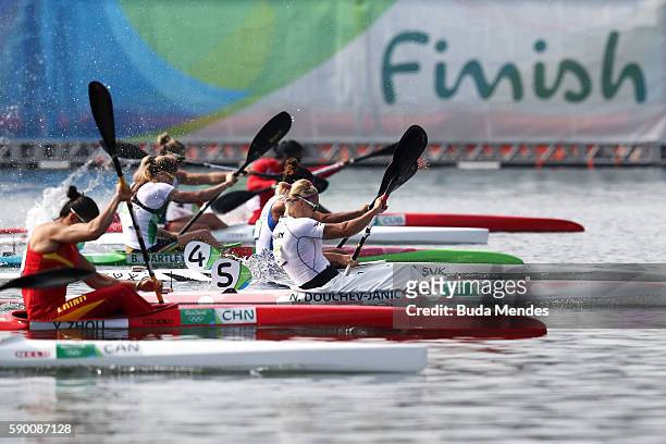Natasa Douchev-Janic of Hungary and Yu Zhou of China compete during the Women's Kayak Single 200m Final B on Day 11 of the Rio 2016 Olympic Games at...