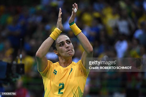 Brazil's pivot Fabiana Diniz applauds after being defeated by Netherlands at the end of the women's quarterfinal handball match Brazil vs Netherlands...