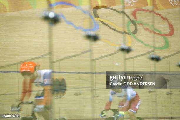 Netherlands' Elis Ligtlee races Russia's Anastasiia Voinova during the Women's sprint quarter-finals track cycling event at the Velodrome during the...