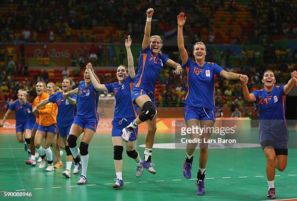 Estavana Polman of Netherlands celebrates with her team mates after winning the Womens Quarterfinal match between Brazil and Netherlands on Day 11 of...