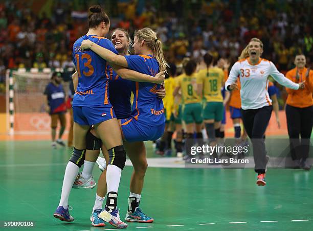 Angela Malestein of Netherlands, Nycke Groot of Netherlands and Yvette Broch of Netherlands celebrate during the Womens Quarterfinal match between...