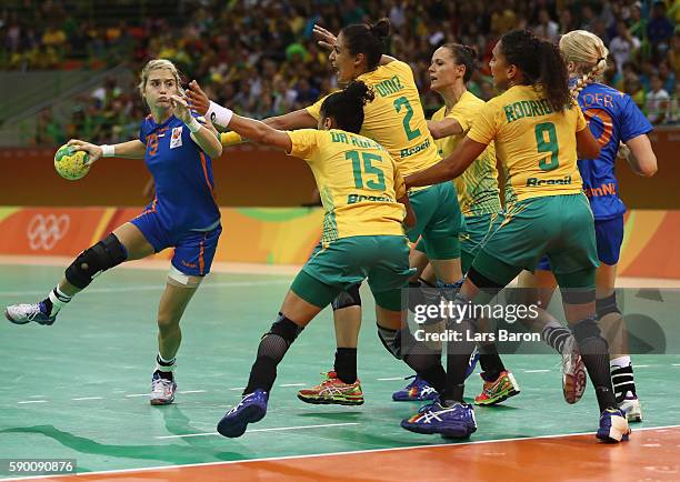 Estavana Polman of Netherlands is challenged by four players of Brazil during the Womens Quarterfinal match between Brazil and Netherlands on Day 11...