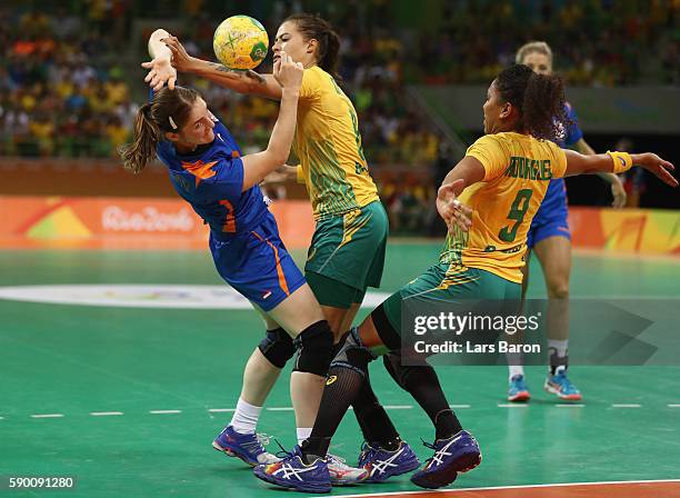 Laura van der Heijden of Netherlands is challenged by Fernanda Franca da Silva of Brazil and Ana Paula Belo of Brazil during he Womens Quarterfinal...