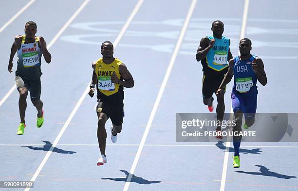 Germany's Robin Erewa, Jamaica's Yohan Blake, Bahamas's Shavez Hart and USA's Ameer Webb compete in the Men's 200m Round 1 during the athletics event...