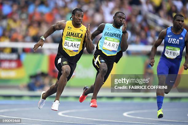Jamaica's Yohan Blake, Bahamas's Shavez Hart, and USA's Ameer Webb compete in the Men's 200m Round 1 during the athletics event at the Rio 2016...