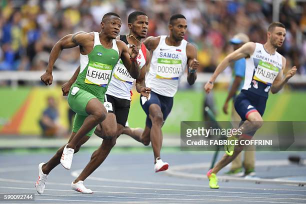 Lesotho's Mosito Lehata Samoa's Jeremy Dodson, and Britain's Daniel Talbot compete in the Men's 200m Round 1 during the athletics event at the Rio...