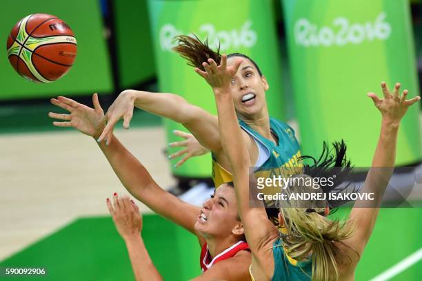 Serbia's shooting guard Ana Dabovic goes to the basket between Australia's forward Laura Hodges and Australia's forward Penny Taylor during a Women's...