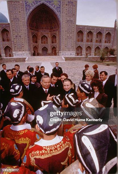 First Lady Hillary Clinton with Uzbek President Islam Karimov , chat with a group of young traditional Uzbek musicians, November 14, 1997 in...