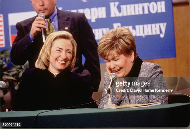 First Lady Hillary Clinton and Mrs. Naina Yeltsin, wife of the Russian President Boris Yeltsin , laugh at a town hall meeting sponsored by the Urals...