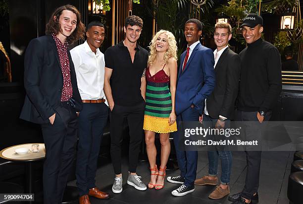 Pixie Lott poses with models Liam Gardner, Kemar Cummins, Christian Arno Williams, O'Shea Robertson, Rob Knighton and Omari Dixon at the launch of...