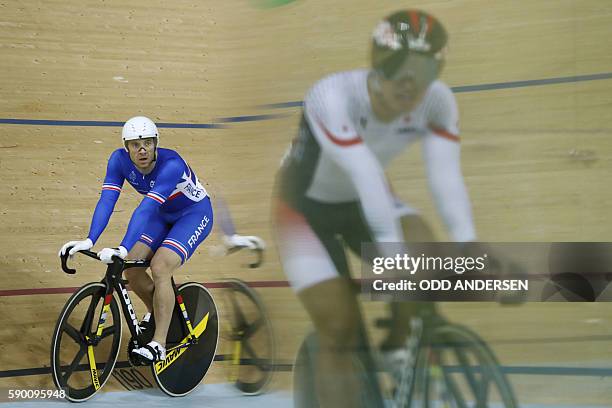 France's Francois Pervis reacts after the Men's Keirin repechage track cycling event at the Velodrome during the Rio 2016 Olympic Games in Rio de...