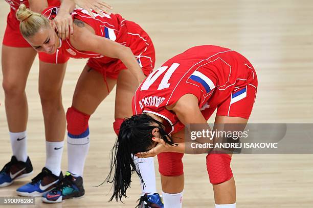 Serbia's shooting guard Ana Dabovic reacts next to Serbia's point guard Milica Dabovic after defeating Australia during a Women's quarterfinal...
