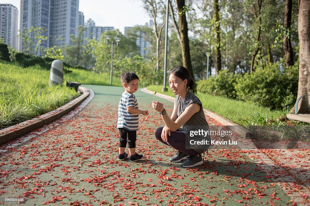Toddler boy with mum at park