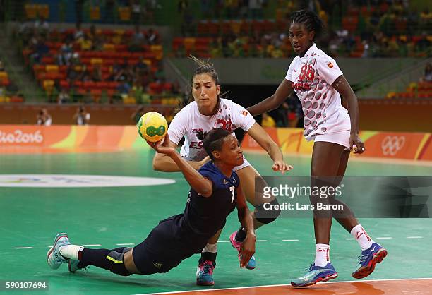 Allison Pineau of France is challenged by Lara Ortega Gonzalez of Spain during the Womens Quarterfinal match between Spain and France on Day 11 of...