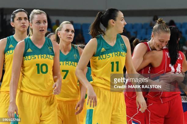 Australia's centre Marianna Tolo, Australia's small forward Rachel Jarry, Australia's forward Penny Taylor and Australia's forward Laura Hodges react...