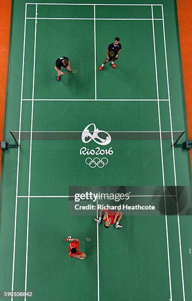 Fu Haifeng and Zhang Nan of China celebrate their victory over Marcus Ellis and Chris Langridge in the Badminton Men's Doubles Semi-Final at...