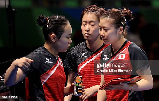 Mima Ito, Kasumi Ishikawa and Ai Fukuhara of Japan talk during the Womens Team Bronze Medal match on Day 11 of the Rio 2016 Olympic Games at the...