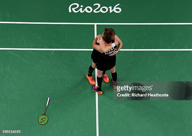 Christinna Pedersen and Kamilla Rytter Juhl of Denamrk celebrate their victory over Tang Yuanting and Yu Yang of China in the Badminton Women's...