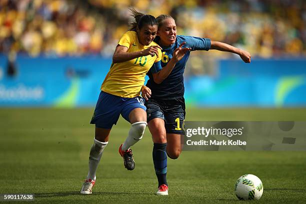Elin Rubensson of Sweden and Marta of Brazil in action during the Women's Football Semi Final between Brazil and Sweden on Day 11 of the Rio 2016...