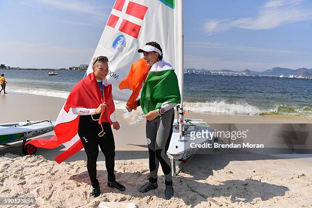 Rio , Brazil - 16 August 2016; Annalise Murphy of Ireland, right, and Anne-Marie Rindom of Denmark celebrate winning silver and bronze respectively...