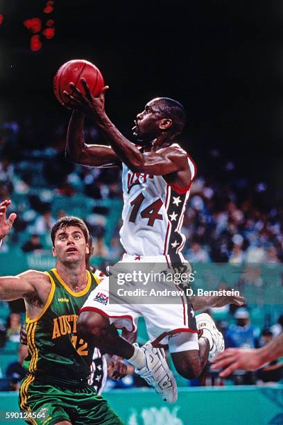 Gary Payton of the USA Basketball Men's National Team drives to the basket during the semifinals against Australia at the Georgia Dome in 1996 in...