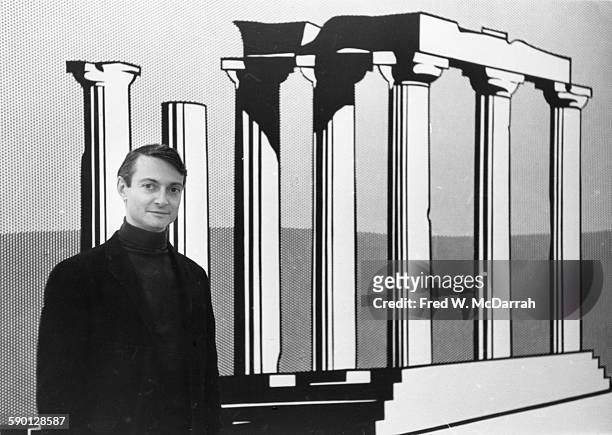 American Pop artist Roy Lichtenstein poses in front of his work, 'Temple of Apollo,' at the Leo Castelli Gallery, New York, New York, October 24,...