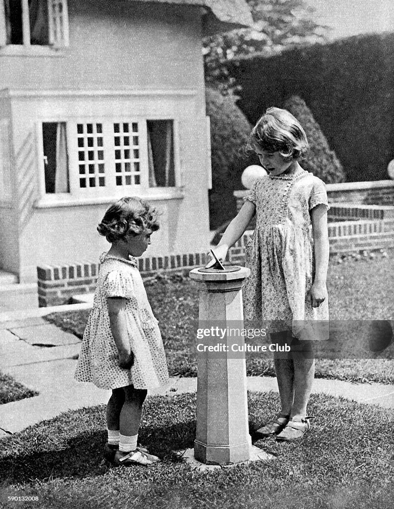 Princess Elizabeth (to become Queen Elizabeth II) and Princess Margaret as children in the 'grounds' of the model house
