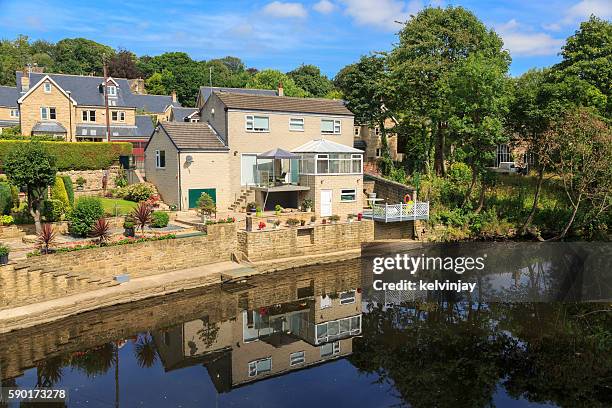 houses by the river aire in leeds - river aire stock pictures, royalty-free photos & images