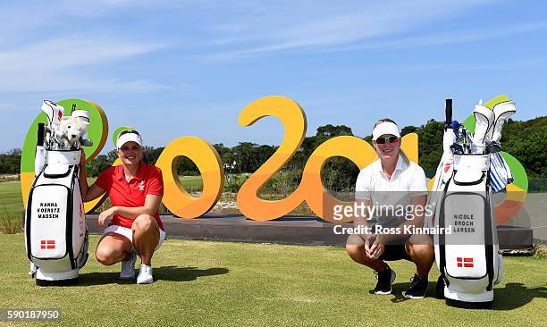 Nanna Koerstz Madsen and Nicole Broch Larsen of Denmark pose with the Rio 2016 sign during a practice round prior to the Women's Individual Stroke...
