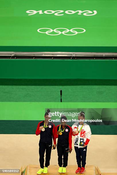 Silver medalist Alexandra Raisman of the United States, gold medalist Simone Biles of the United States and Amy Tinkler of Great Britain pose for...