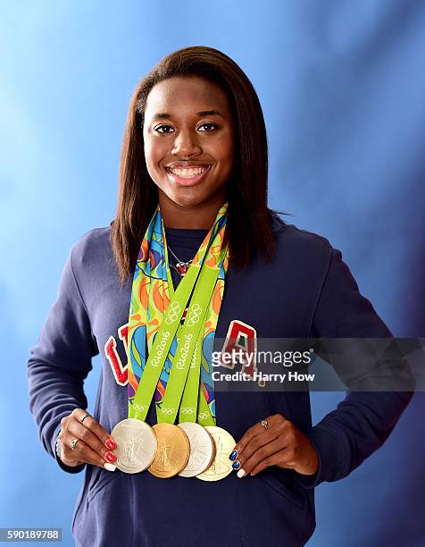 Swimmer, Simone Manuel of the United States poses for a photo with her four medals on the Today show set on Copacabana Beach on August 15, 2016 in...