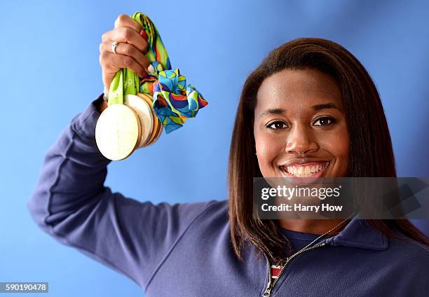 Swimmer, Simone Manuel of the United States poses for a photo with her four medals on the Today show set on Copacabana Beach on August 15, 2016 in...