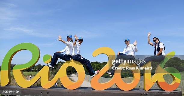 Giulia Sergas and Giulia Molinaro of Itlay pose with the Rio 2016 sign during a practice round prior to the Women's Individual Stroke Play golf at...