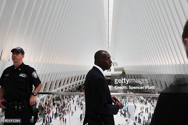 Security and police keep watch at the newly opened Westfield World Trade Center shopping mall at the Oculus on opening day on August 16, 2016 in New...