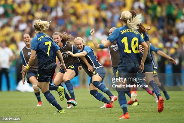 Lisa Dahlkvist of Sweden and her teammates celebrate victory in the Women's Football Semi Final between Brazil and Sweden on Day 11 of the Rio 2016...