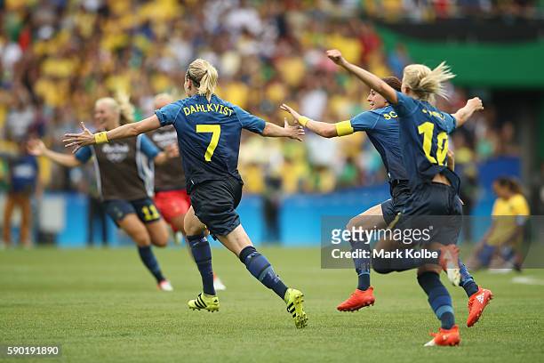 Lisa Dahlkvist of Sweden and her teammates celebrate victory in the Women's Football Semi Final between Brazil and Sweden on Day 11 of the Rio 2016...