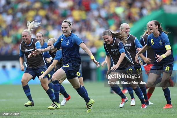 Lisa Dahlkvist of Sweden and her teammates celebrate victory in the Women's Football Semi Final between Brazil and Sweden on Day 11 of the Rio 2016...