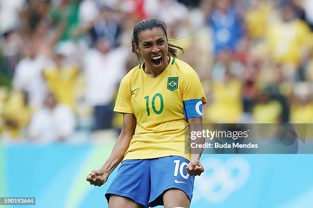 Marta of Brazil celebrates a penalty during the Women's Football Semi Final between Brazil and Sweden on Day 11 of the Rio 2016 Olympic Games at...