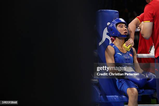 Cancan Ren of China sits in her corner during the fight with Mandy Bujold of Canada in the boxing Women's Fly Quarterfinal 2 on Day 11 of the Rio...