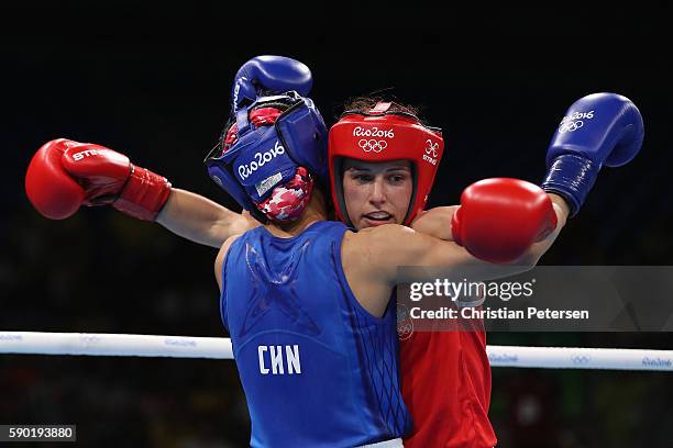 Mandy Bujold of Canada is tied up with Cancan Ren of China in the boxing Women's Fly Quarterfinal 2 on Day 11 of the Rio 2016 Olympic Games at...