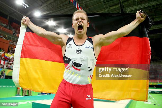 Fabian Hambuechen of Germany celebrates winning the gold medal after competing on the Horizontal Bar Final on Day 11 of the Rio 2016 Olympic Games at...