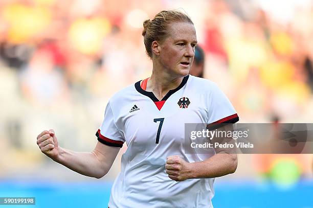 Melanie Behringer of Germany celebrates scoring a goal during the Women's Semi Final match between Germany and Canada on Day 11 of the Rio 2016...