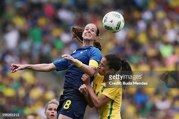 Lotta Schelin of Sweden heads the ball during the Women's Football Semi Final between Brazil and Sweden on Day 11 of the Rio 2016 Olympic Games at...