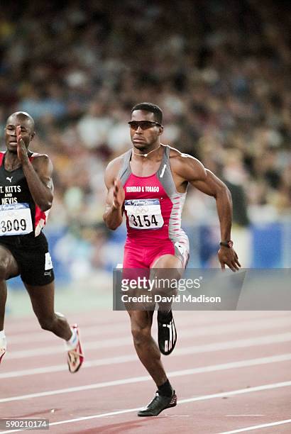 Ato Boldon of Trinidad and Tobago competes in the second round of the 100 meter race of the Athletics competition of the 2000 Olympic Games held on...