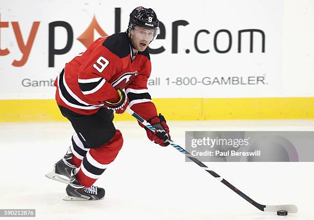 Jiri Tlusty of the New Jersey Devils plays in the game against at the Prudential Center on October 16, 2015 in Newark, New Jersey.