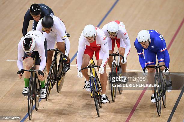 Germany's Joachim Eilers and France's Francois Pervis compete in the Men's Keirin round 2 track cycling event at the Velodrome during the Rio 2016...