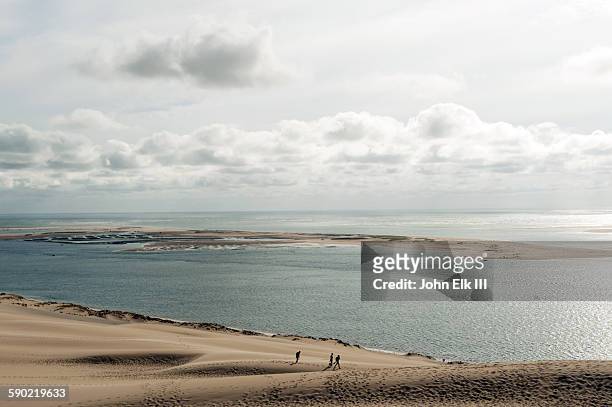 people walking on dune de pyla pilat dune - arcachon stock pictures, royalty-free photos & images
