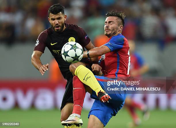 Sergio Aguero of Manchester City vies with Jugurtha Hamroun of Steaua Bucharest during the UEFA Champions league first leg play-off football match...