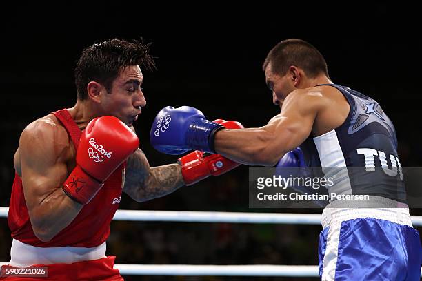 Artem Harutyunyan of Germany fights against Batuhan Gozgec of Turkey during the Men's Light Welter Quarterfinal 3 on Day 11 of the Rio 2016 Olympic...
